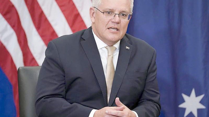 Australiens Premierminister Scott Morrison ist noch unschlüssig, ob er zum UN-Klimagipfel fährt. Foto: Evan Vucci/AP/dpa/Archivbild