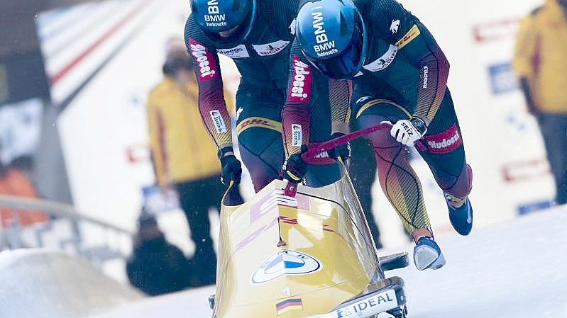 Francesco Friedrich und Thorsten Margis siegten im Eiskanal von Innsbruck. Foto: Lisa Leutner/AP/dpa