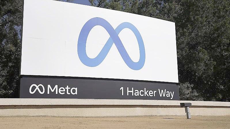 Das Logo von Meta, der neuen Dachmarke des Facebook-Konzerns. Foto: Tony Avelar/AP/dpa