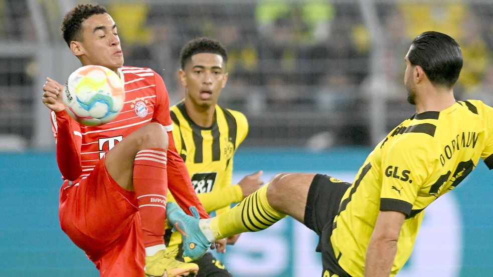 In der Nationalmannschaft Teamkollegen, am Sonnabend Gegner im Bundesliga-Topspiel: Münchens Jamal Musiala (links) und Dortmunds Emre Can (rechts). Foto: Bernd Thissen/DPA