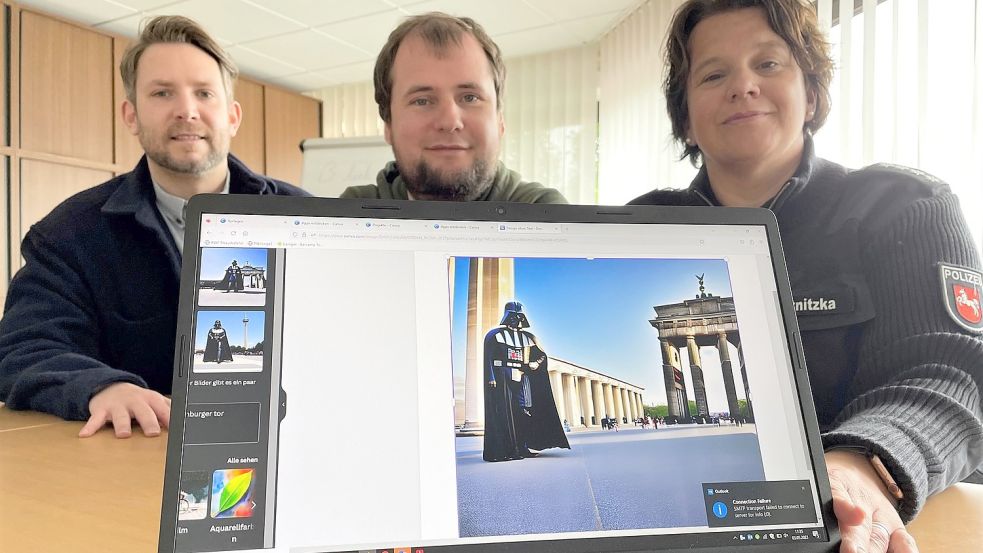 Tim Kempen (von links), Schulsozialarbeiter der Erich-Kästner-Schule, Präventionskraft Nico Bergmann und Melanie Gornitzka, Leiterin der Rhauderfehner Polizeidienststelle, mit einem schnell am Notebook entworfenen Bild, das die Filmfigur Darth Vader am Brandenburger Tor zeigt. Neben den Bildfäschungs-Programmen sorgt derzeit die Sprach-Text-KI ChatGPT für Aufsehen – und Sorgen. Foto: Janßen