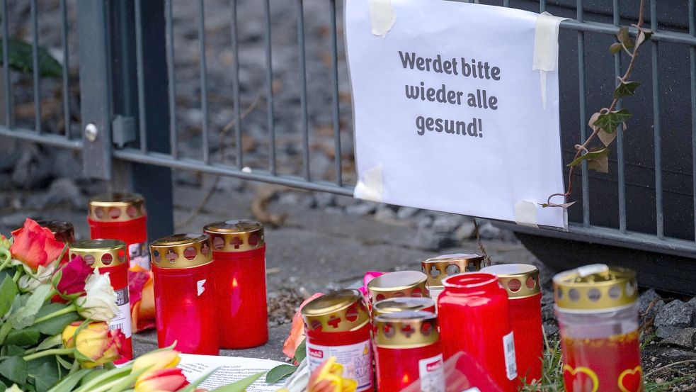 Die Menschen in München trauern nach dem Anschlag: Nun ist ein Kind den Verletzungen erlegen. Foto: dpa/Pia Bayer