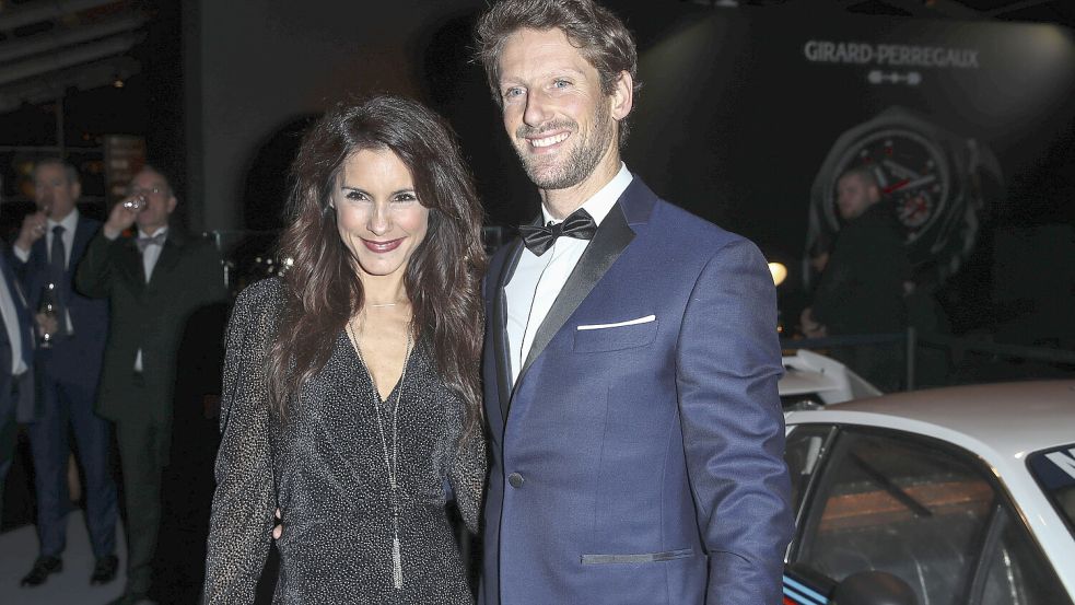 Marion Grosjean zusammen mit ihrem Ehemann und Rennfahrer Romain Grosjean. Foto: IMAGO/Panoramic by PsnewZ