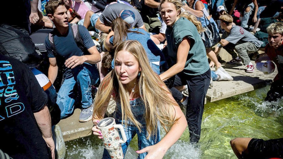 Menschen rennen weg, nachdem Kirk angeschossen wurde. Foto: Tess Crowley/The Deseret News/dp