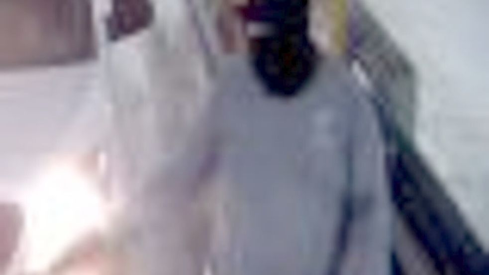 Einer der Maskierten trug grüne Handschuhe. Foto: -/Polizei NRW/dpa