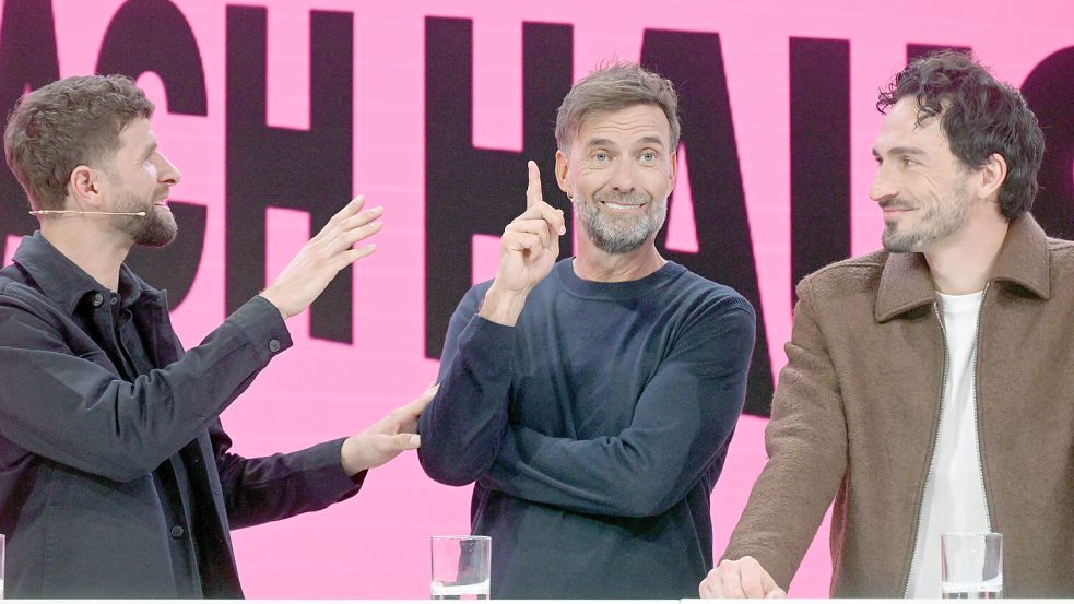 Bei der WM 2026 vor Ort in den USA: Thomas Müller, Jürgen Klopp und Mats Hummels. Foto: dpa/Felix Hörhager