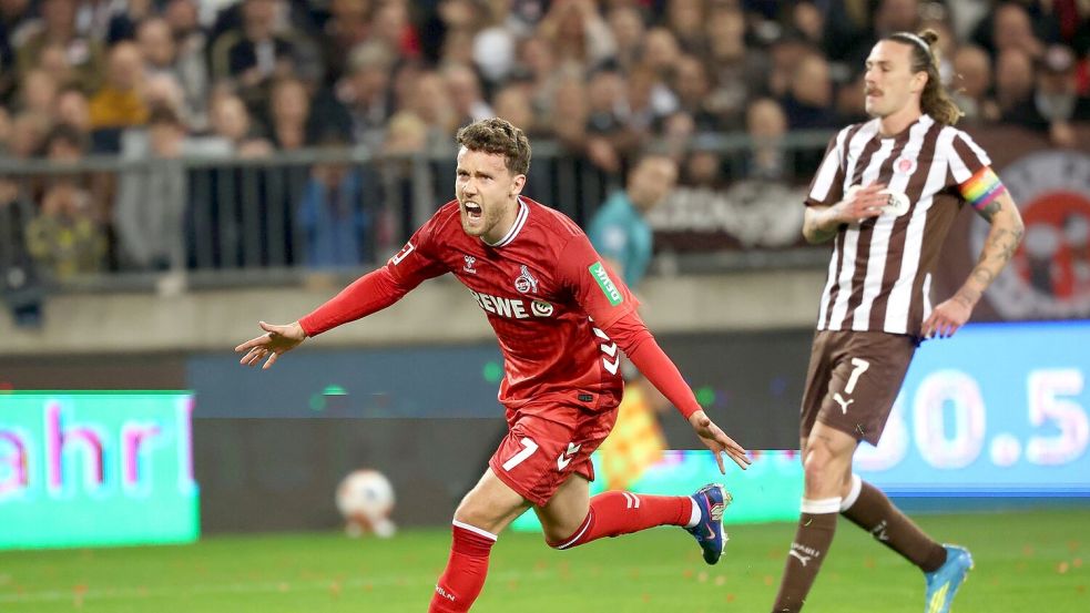 Luca Waldschmid (l, 1. FC Köln) jubelt nach dem Ausgleichstreffer. Foto: Christian Charisius/dpa